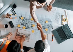 Top,Down,Aerial,View,Of,Architect,Engineer,Team,Shake,Hands